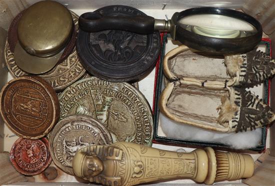 Assorted seals, a trench art cap, an eye glass etc